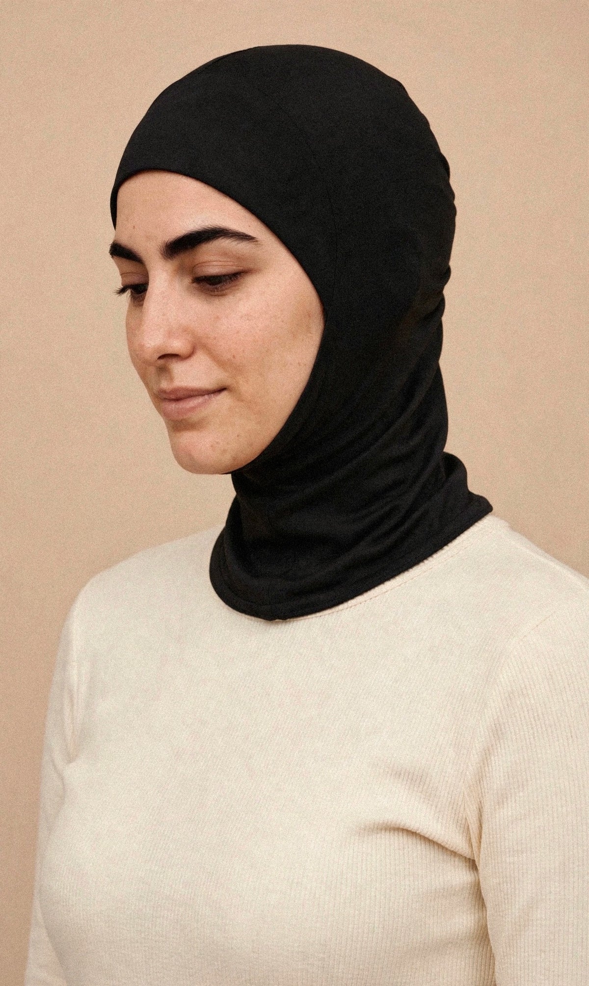 Black - Ninja Underscarf worn by a model — angled view