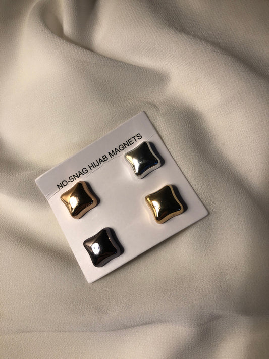 No-snag hijab magnets in metallic finishes, shown on fabric