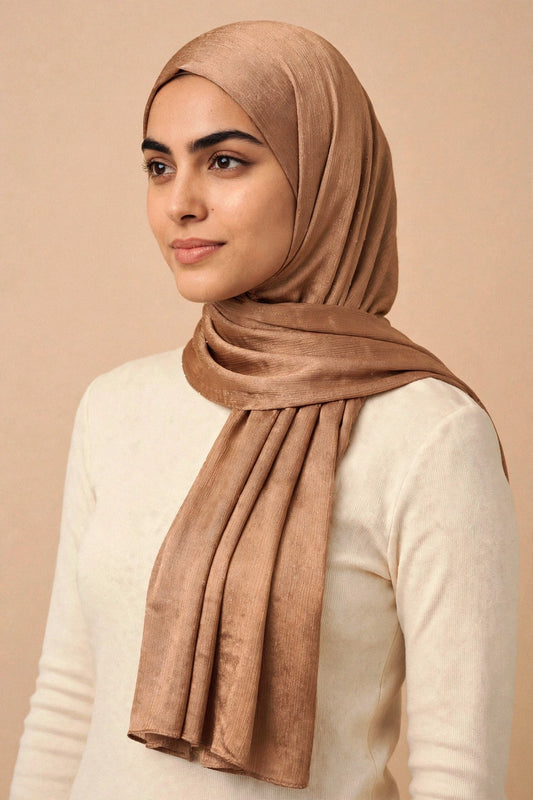 Model wearing the Antique chrome hijab styled with a cream top - Concealed Muslimah