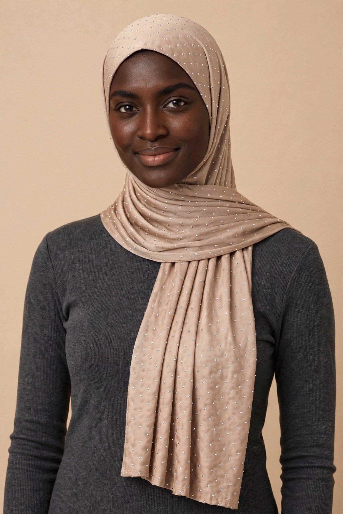 Model wearing the Beige silken diamonds hijab styled with a charcoal top - Concealed Muslimah