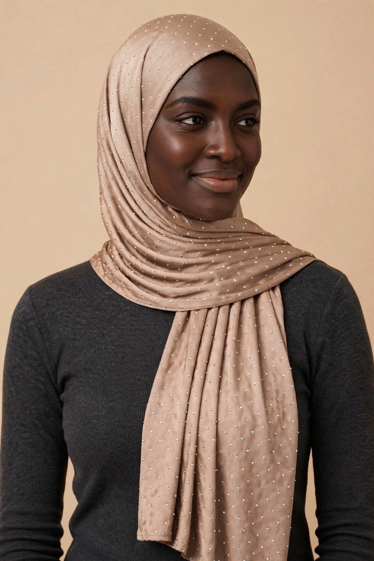 Model wearing the Beige silken diamonds hijab styled with a charcoal top - Concealed Muslimah