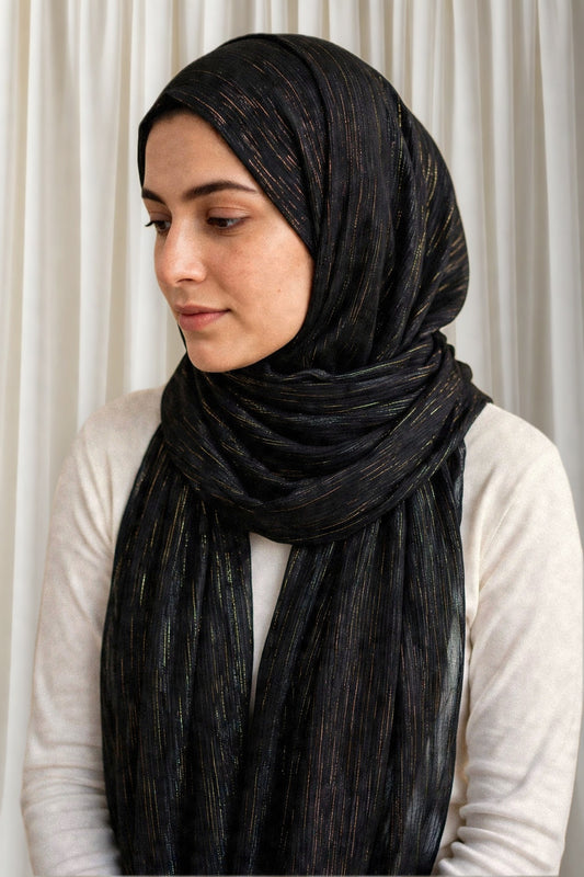 Model wearing the Black timeless edition hijab styled with a white top - Concealed Muslimah