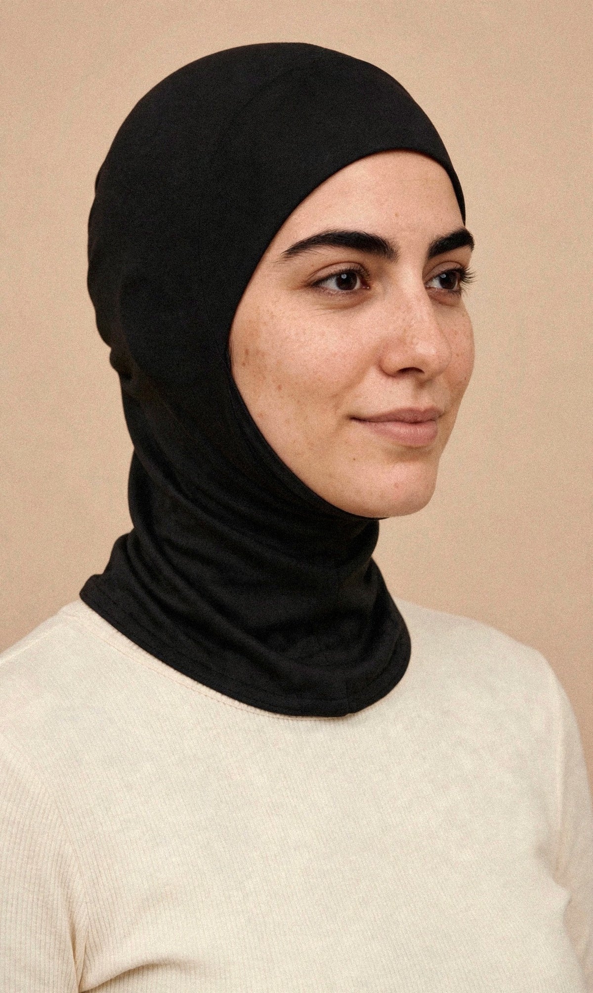 Black - Ninja Underscarf worn by a model — three-quarter view