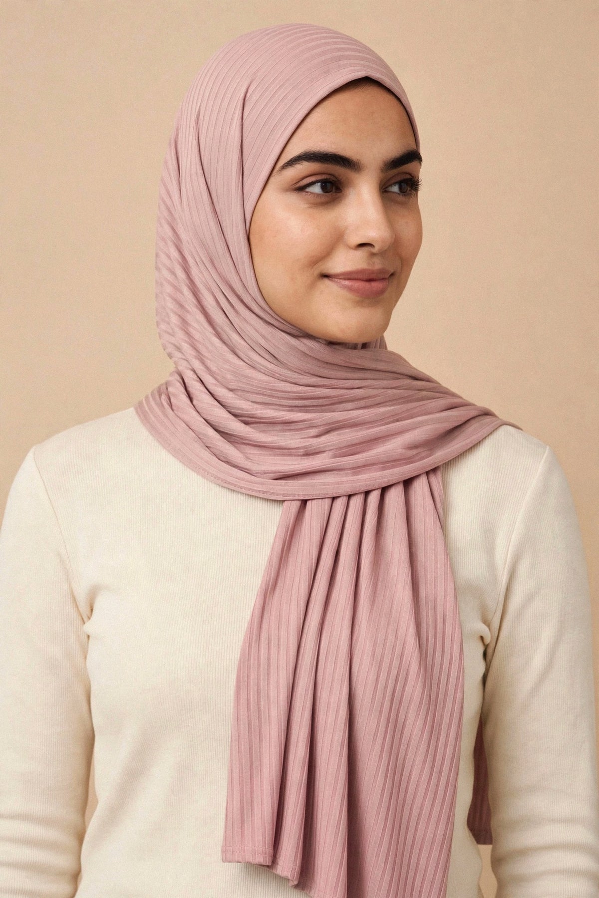 Model wearing the Carnation ribbed jersey hijab styled with a cream top - Concealed Muslimah