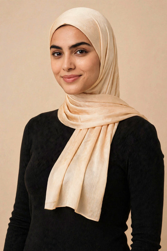 Model wearing the Champagne chrome hijab styled with a charcoal top - Concealed Muslimah