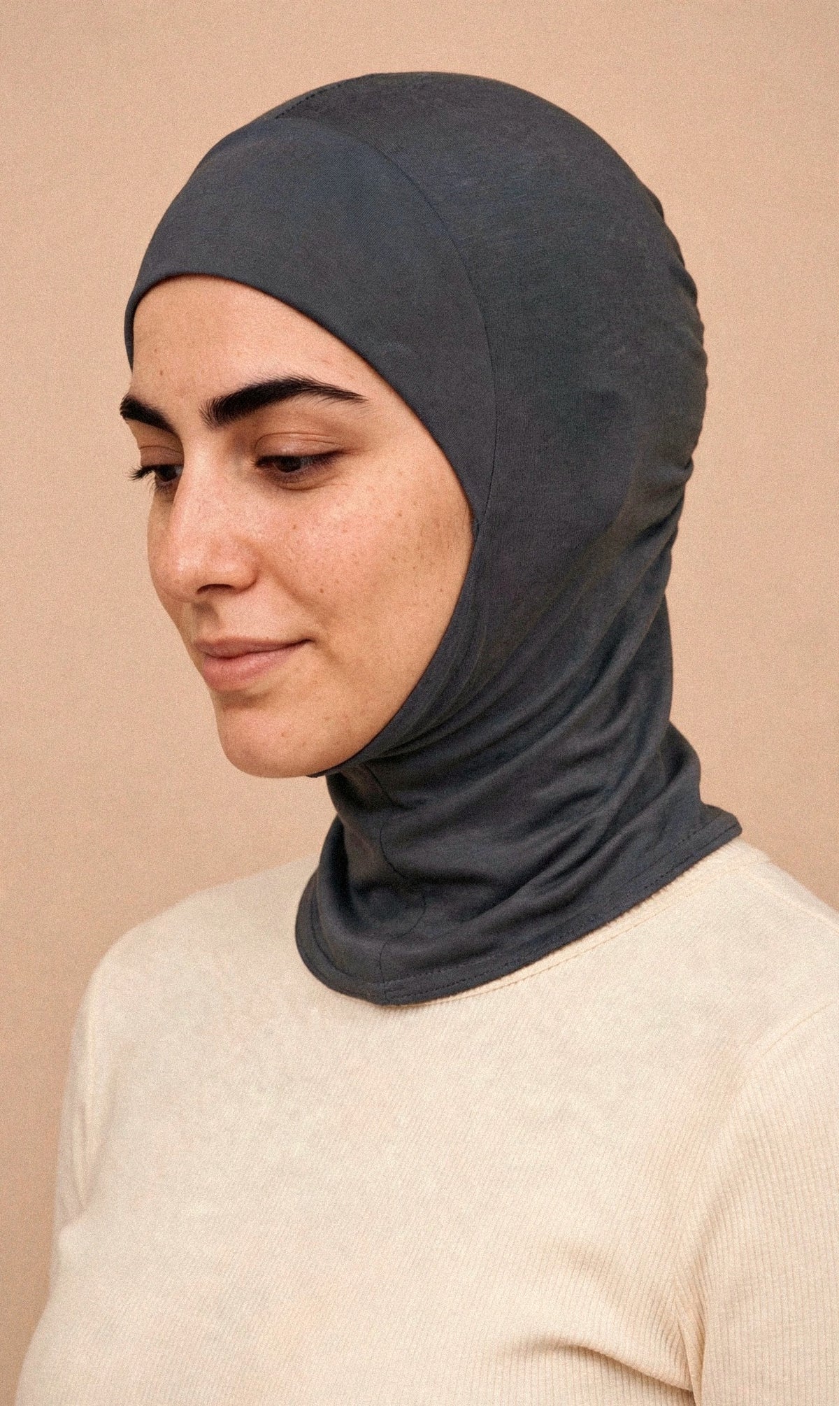Charcoal Grey - Ninja Underscarf worn by a model — angled view
