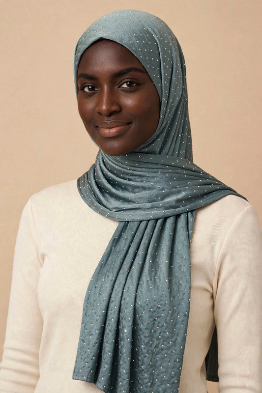 Model wearing the Charcoal Grey silken diamonds hijab styled with a cream top - Concealed Muslimah