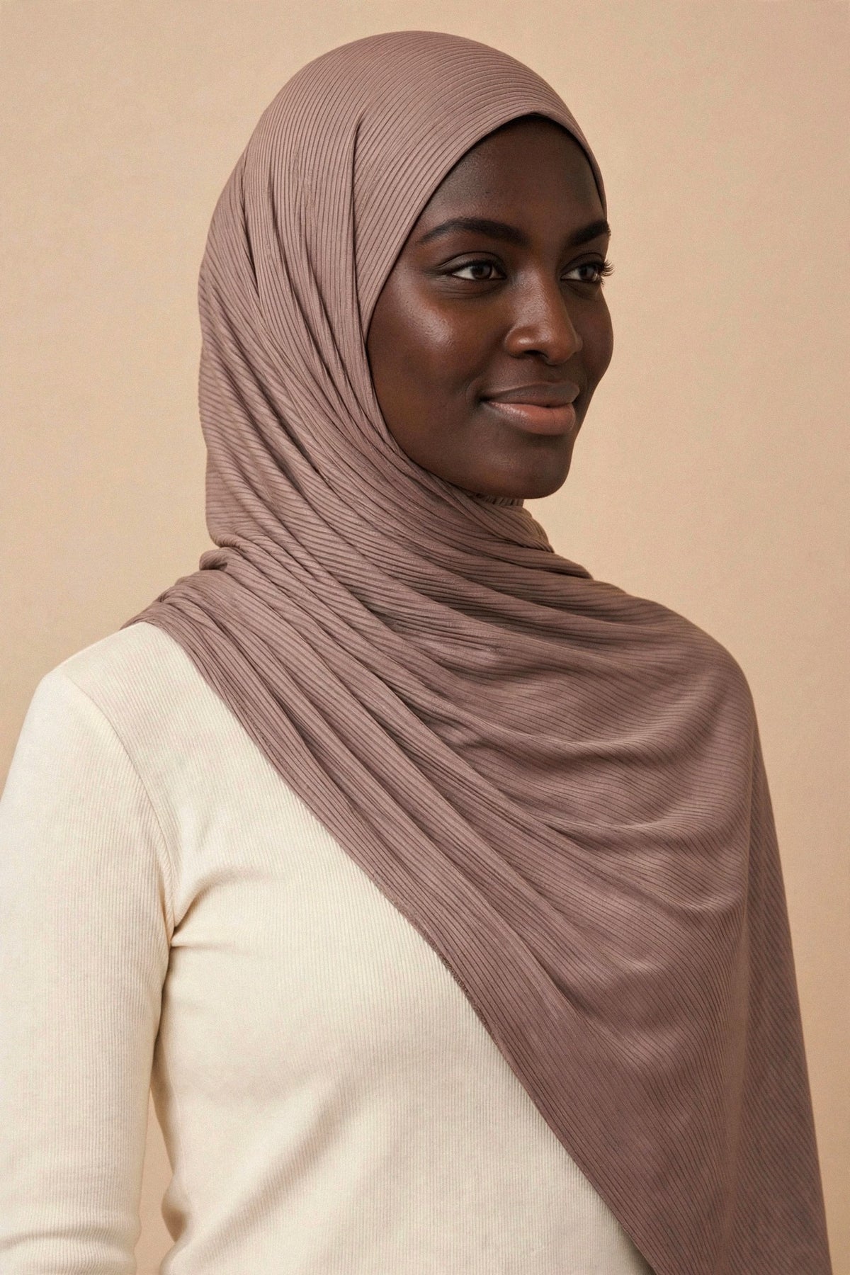 Model wearing the Coffee ribbed jersey hijab styled with a cream top - Concealed Muslimah
