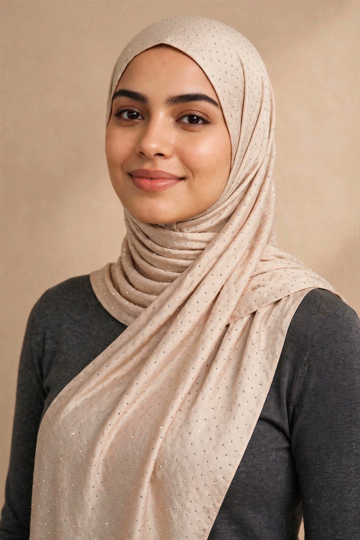 Model wearing the Cream Nude silken diamonds hijab styled with a charcoal top - Concealed Muslimah