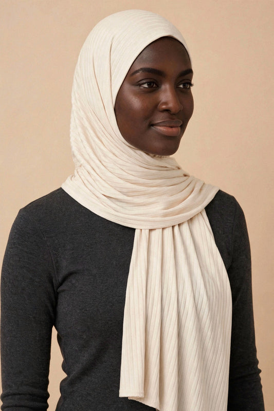 Model wearing the Cream ribbed jersey hijab styled with a charcoal top - Concealed Muslimah