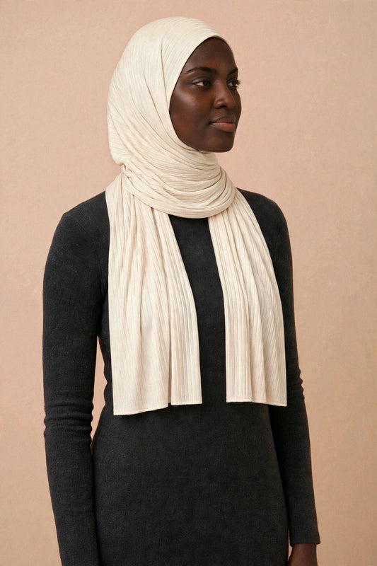 Model wearing the Cream ribbed jersey hijab styled with a charcoal top - Concealed Muslimah