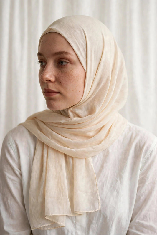 Model wearing the Cream timeless edition hijab styled with a white top - Concealed Muslimah