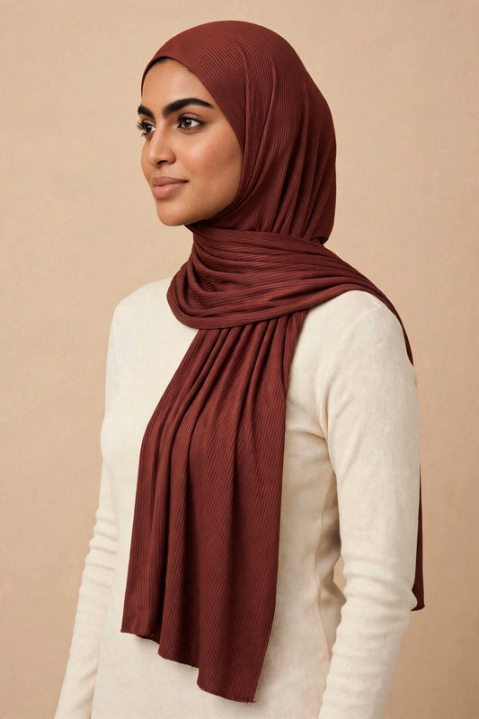 Model wearing the Dark Cinnamon ribbed jersey hijab styled with a cream top - Concealed Muslimah