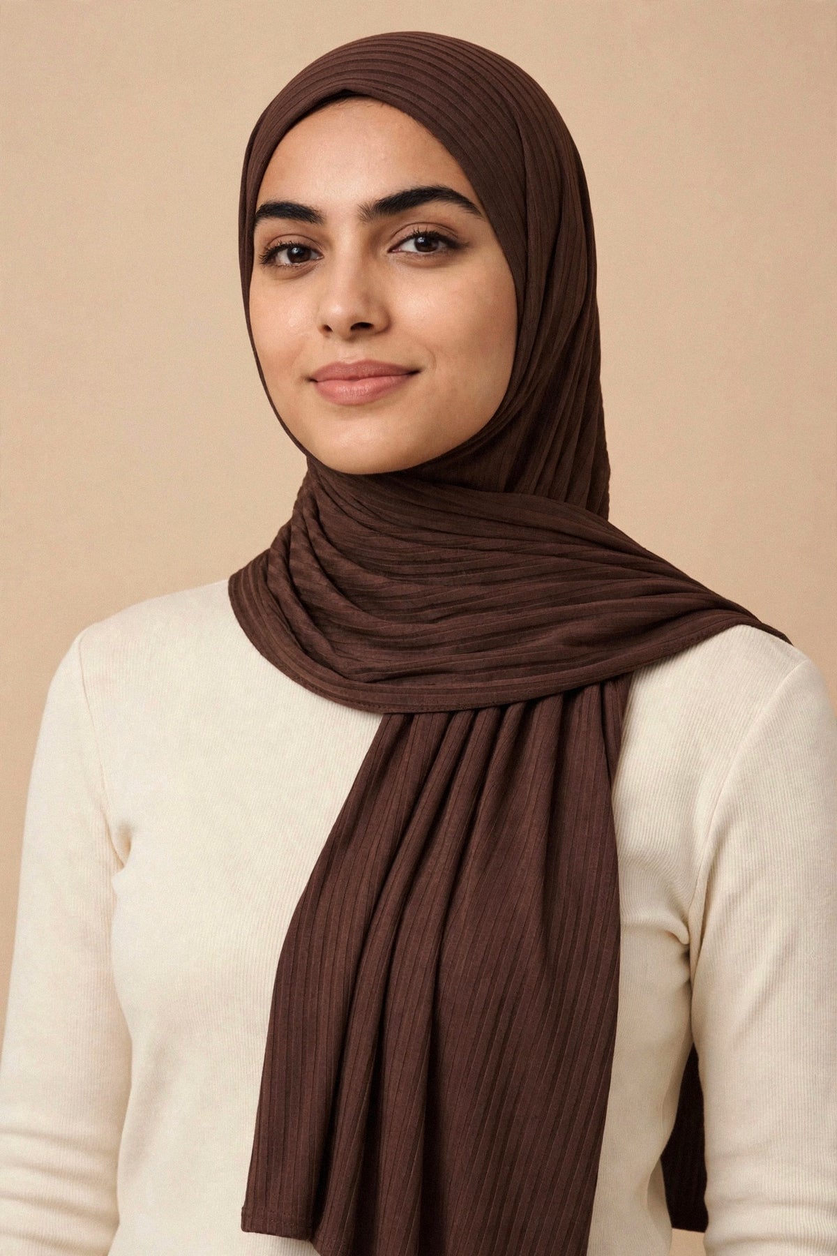 Model wearing the Dark Roast ribbed jersey hijab styled with a cream top - Concealed Muslimah