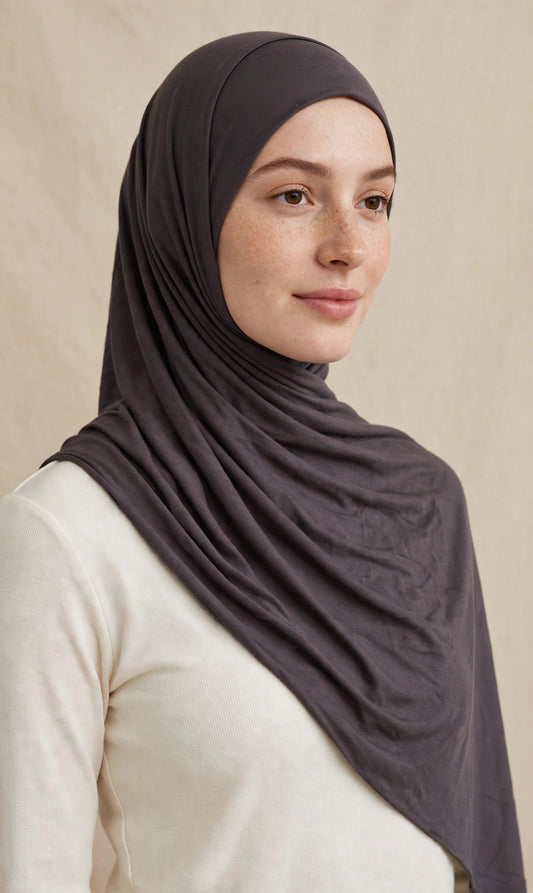 Model wearing the Dark Truffle premium jersey hijab styled with a cream top - Concealed Muslimah