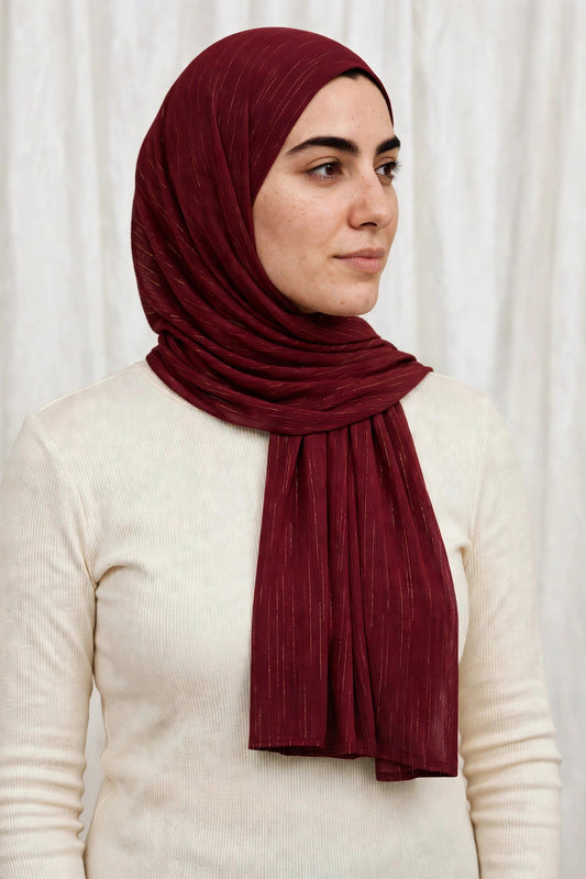 Model wearing the Deep Maroon timeless edition hijab styled with a white top - Concealed Muslimah