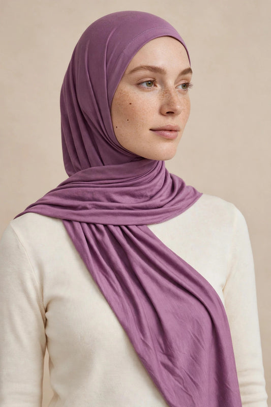 Model wearing the Deep Mauve premium jersey hijab styled with a cream top - Concealed Muslimah