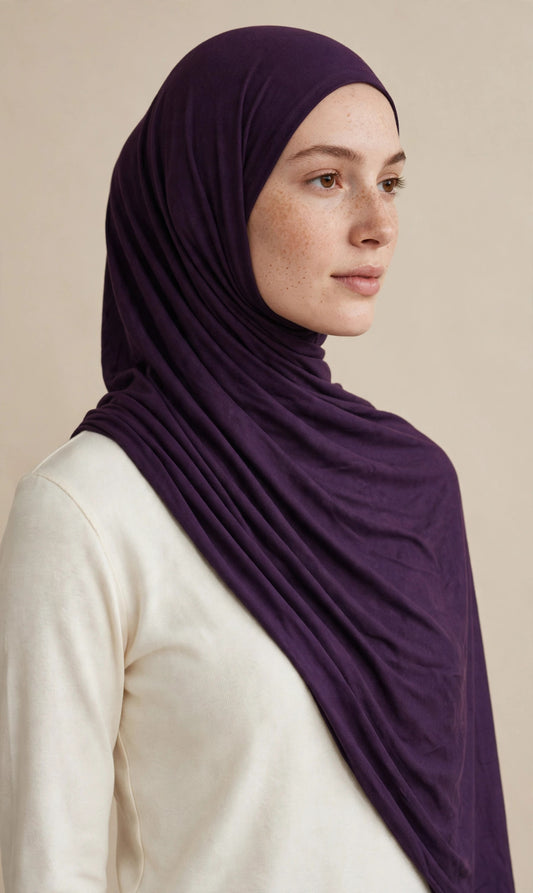 Model wearing the Eggplant premium jersey hijab styled with a cream top - Concealed Muslimah