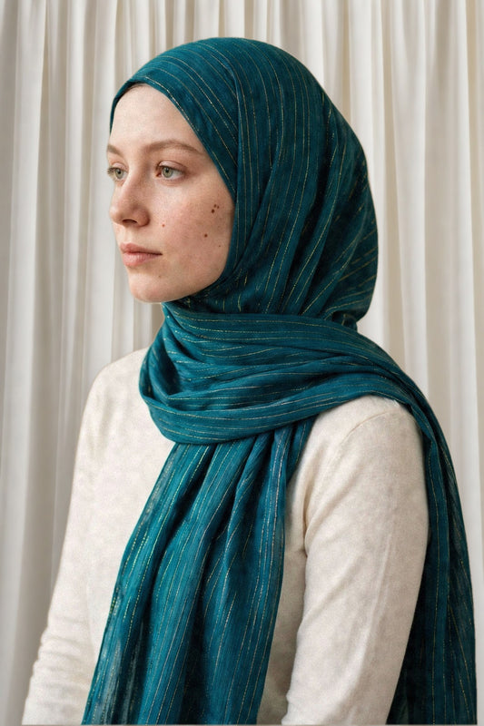 Model wearing the Emerald Green timeless edition hijab styled with a white top - Concealed Muslimah