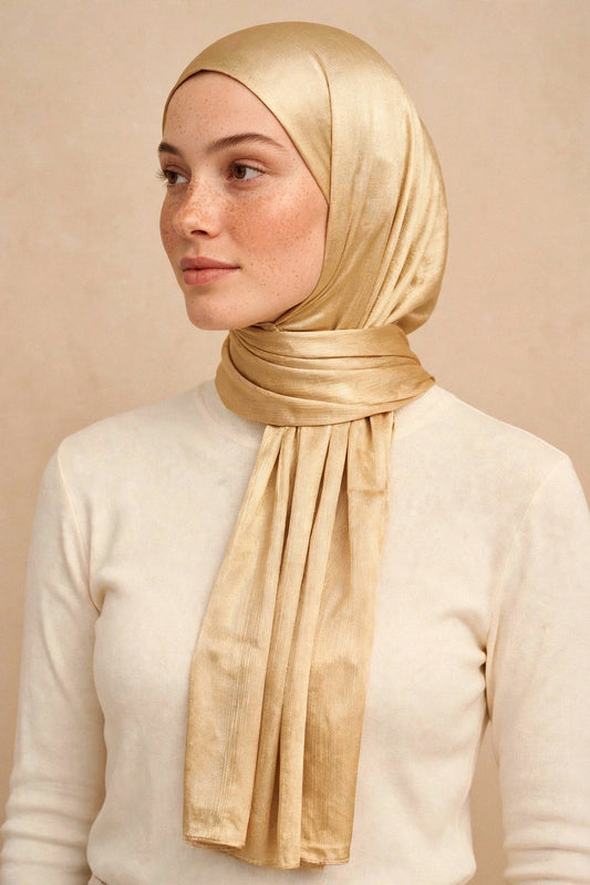 Model wearing the Glam chrome hijab styled with a cream top - Concealed Muslimah