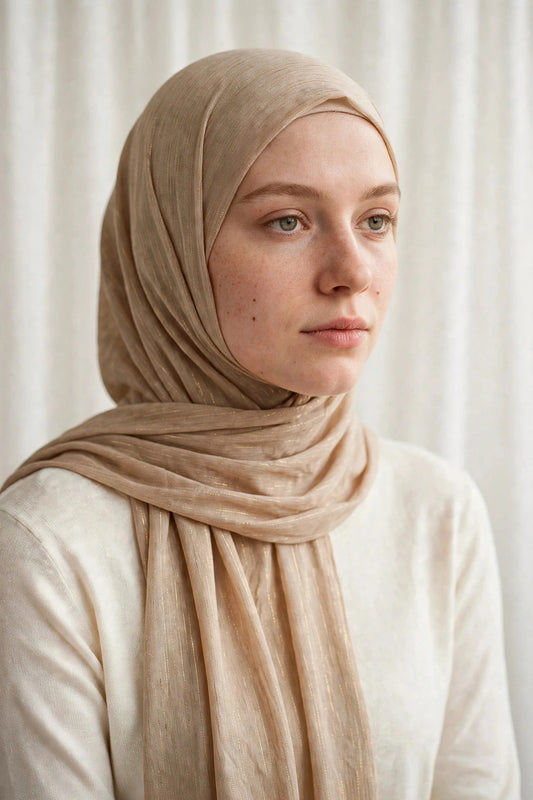 Model wearing the Gold timeless edition hijab styled with a white top - Concealed Muslimah