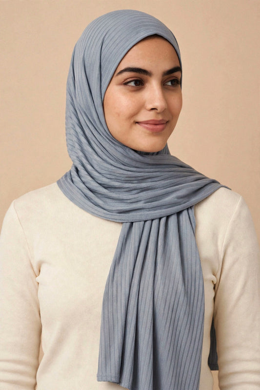 Model wearing the Grey Denim ribbed jersey hijab styled with a cream top - Concealed Muslimah
