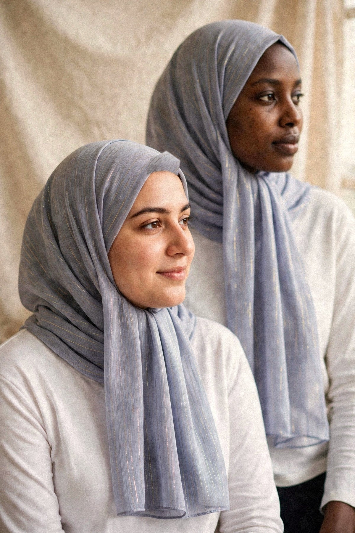 Models wearing the Grey timeless edition hijab styled with white tops - Concealed Muslimah
