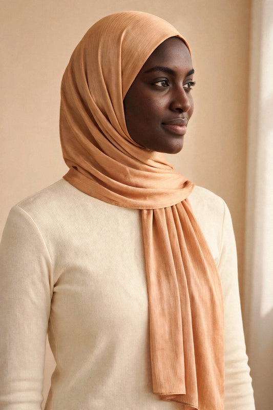 Model wearing the Honey Drizzle chrome hijab styled with a cream top - Concealed Muslimah