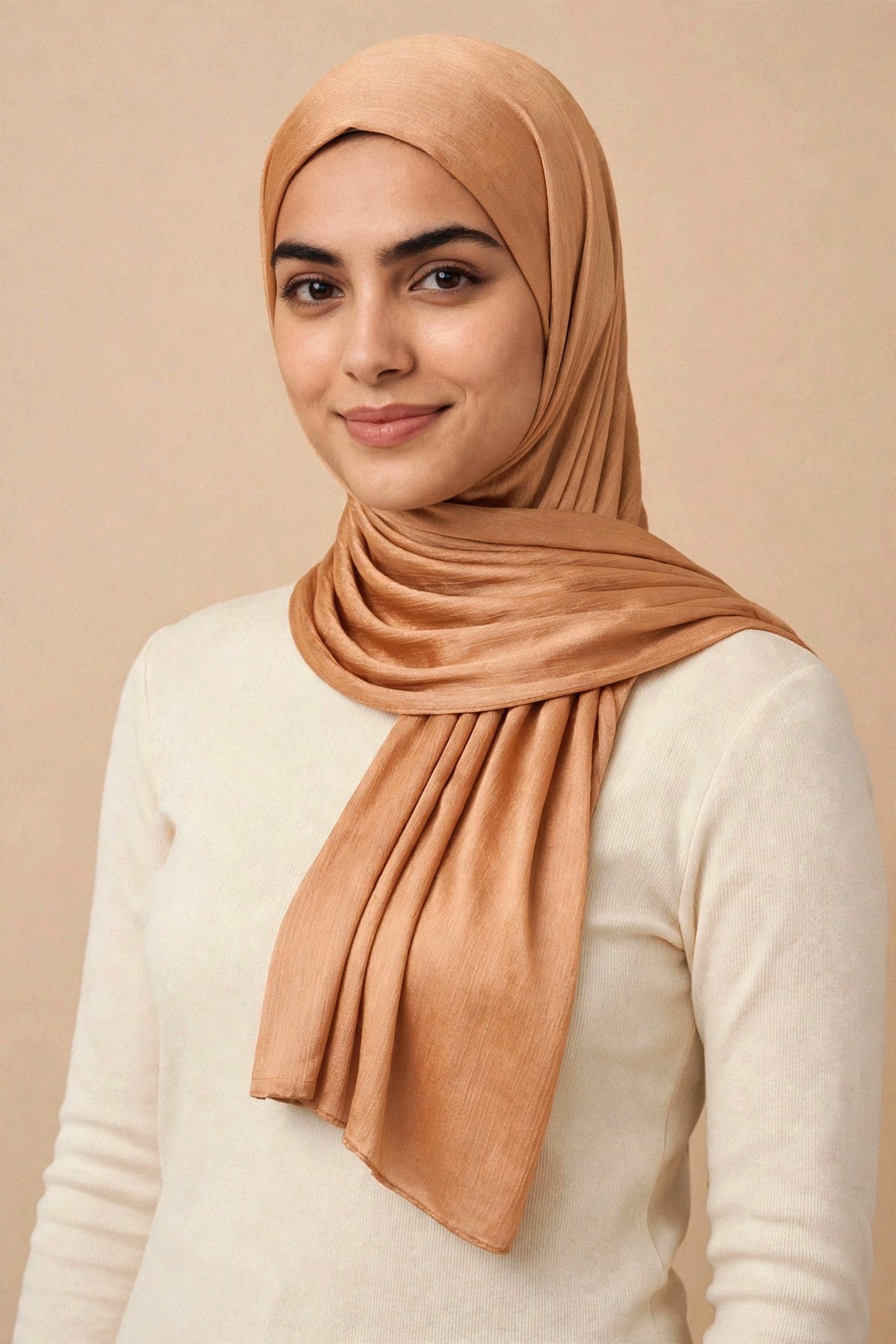 Model wearing the Honey Drizzle chrome hijab styled with a cream top - Concealed Muslimah