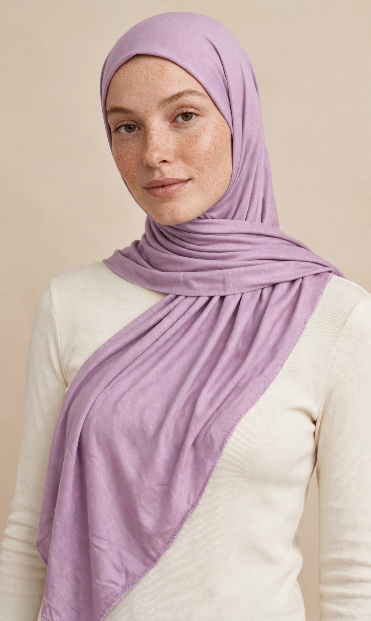 Model wearing the Lavender premium jersey hijab styled with a cream top - Concealed Muslimah
