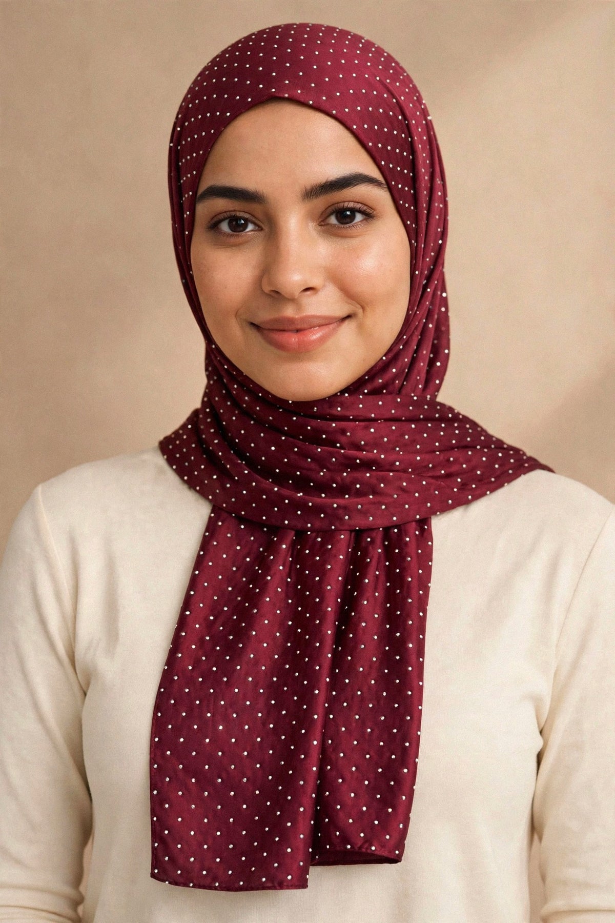 Model wearing the Maroon silken diamonds hijab styled with a cream top — shown on a different skin tone - Concealed Muslimah
