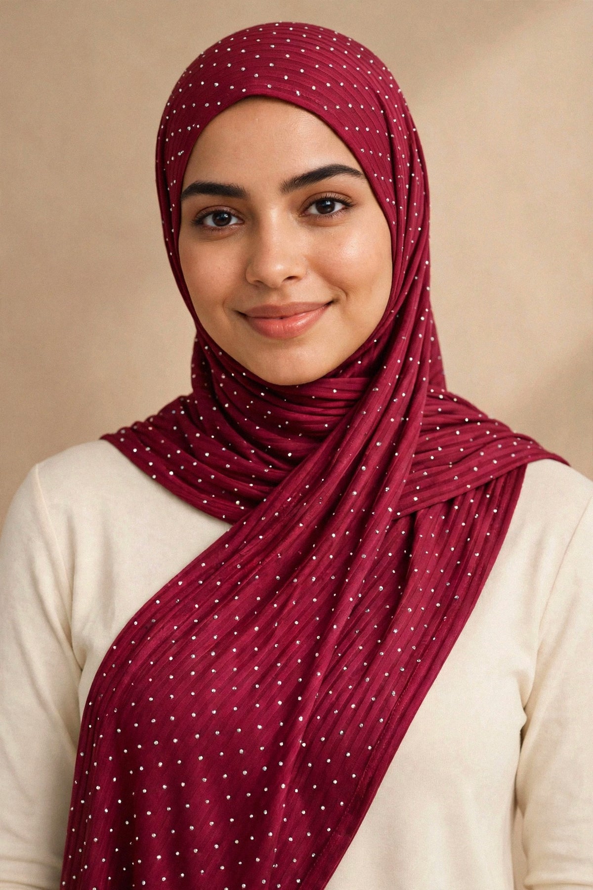 Model wearing the Maroon silken diamonds hijab styled with a cream top — shown on a different skin tone - Concealed Muslimah