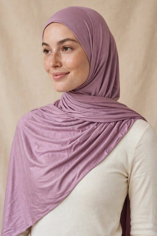 Model wearing the Mauve premium jersey hijab styled with a cream top - Concealed Muslimah