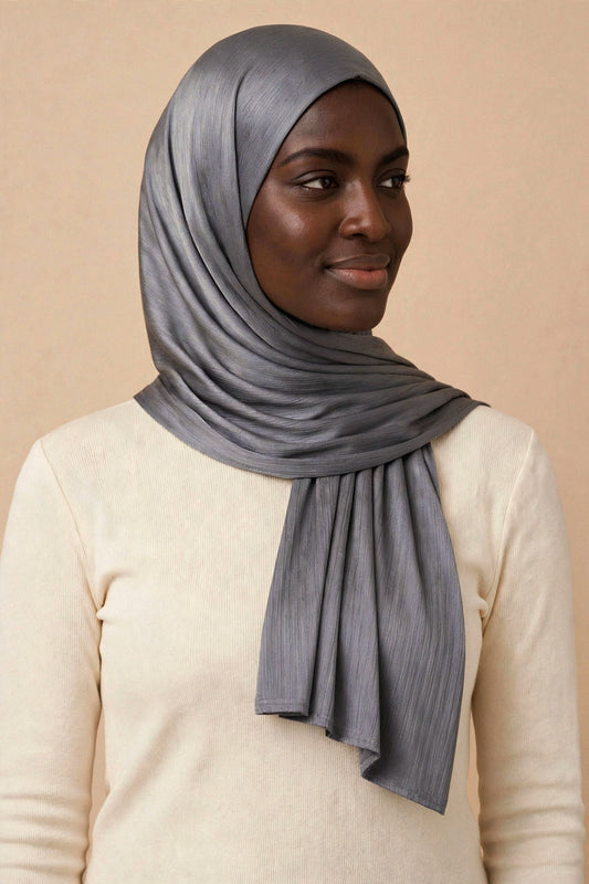 Model wearing the Metallic Grey chrome hijab styled with a cream top - Concealed Muslimah