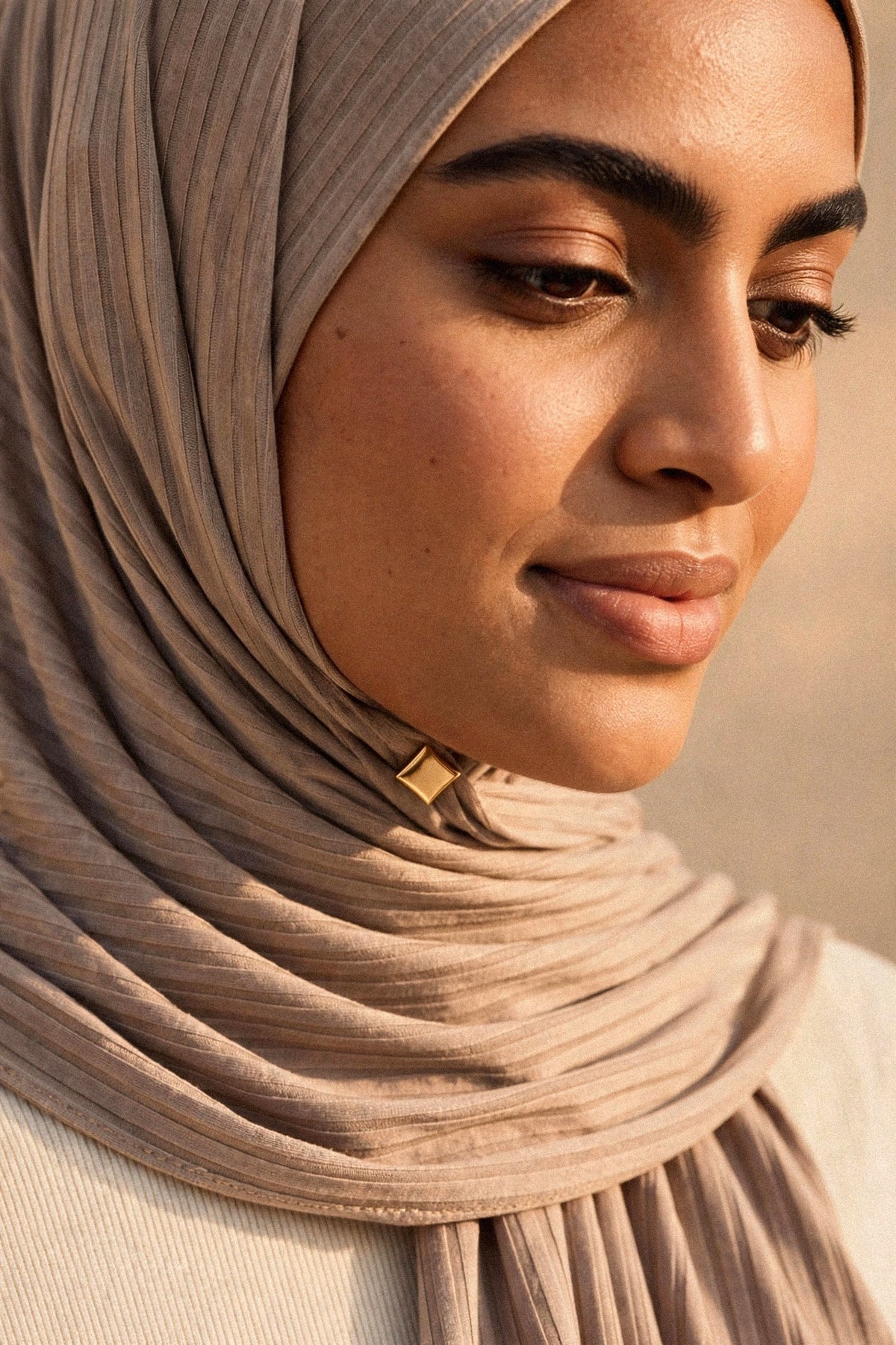 Metallic Hijab Magnets shown fastening a hijab under the chin
