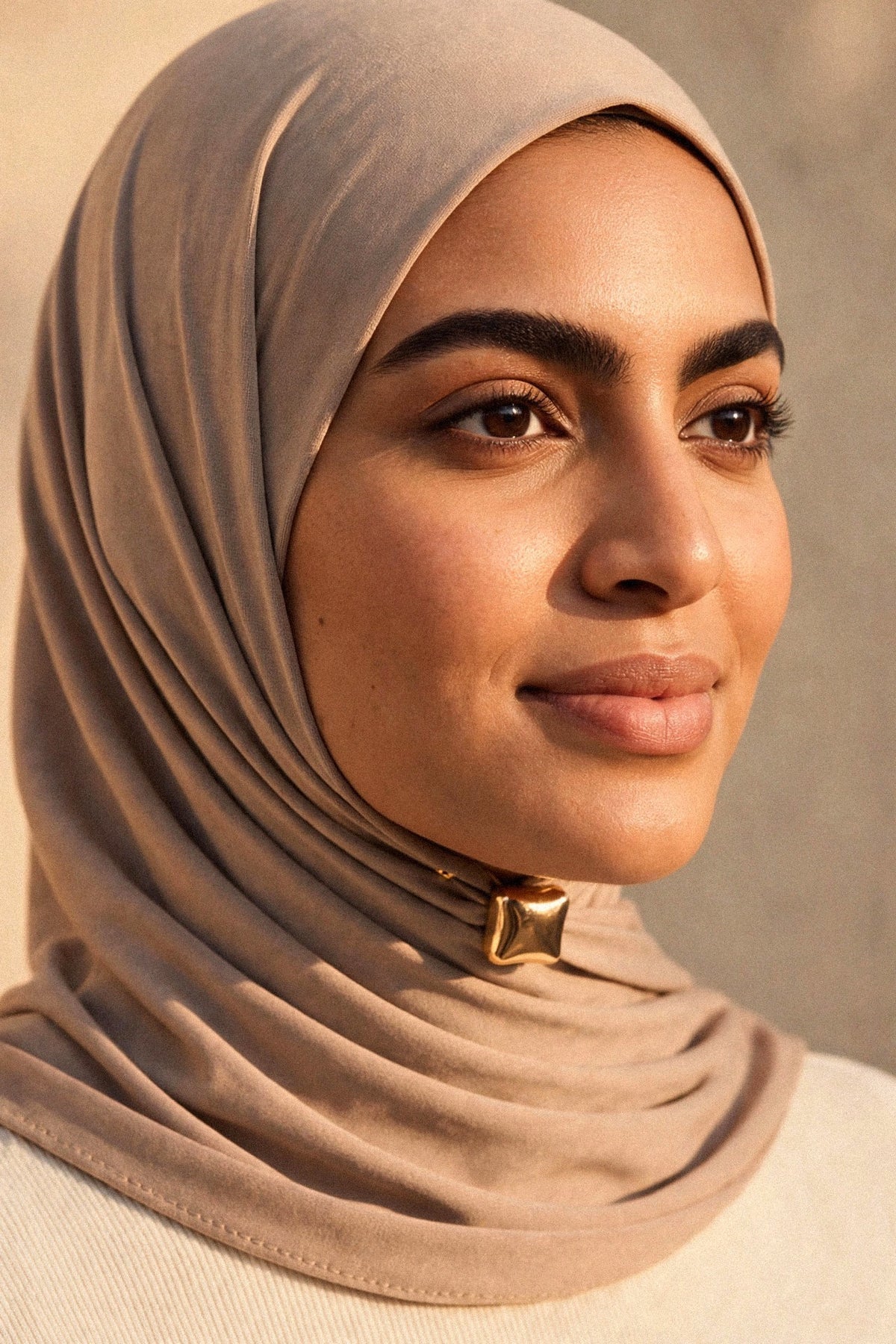 Metallic Hijab Magnets shown fastening a hijab under the chin