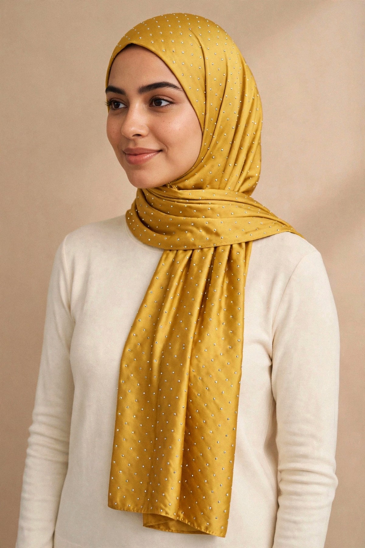 Model wearing the Mustard silken diamonds hijab styled with a cream top — shown on a different skin tone - Concealed Muslimah