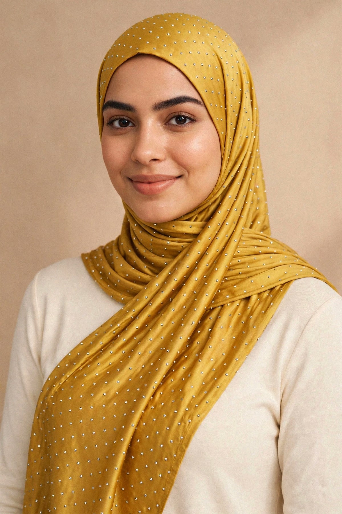 Model wearing the Mustard silken diamonds hijab styled with a cream top — shown on a different skin tone - Concealed Muslimah