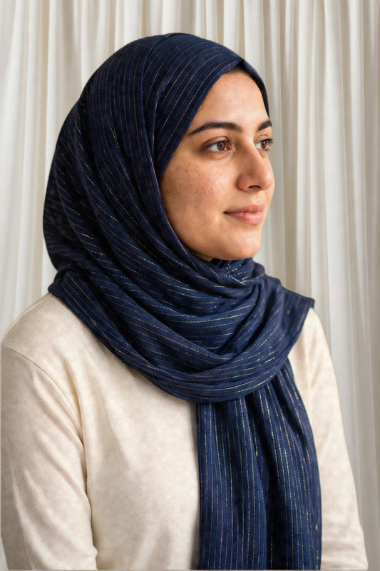 Model wearing the Navy Blue timeless edition hijab styled with a white top - Concealed Muslimah