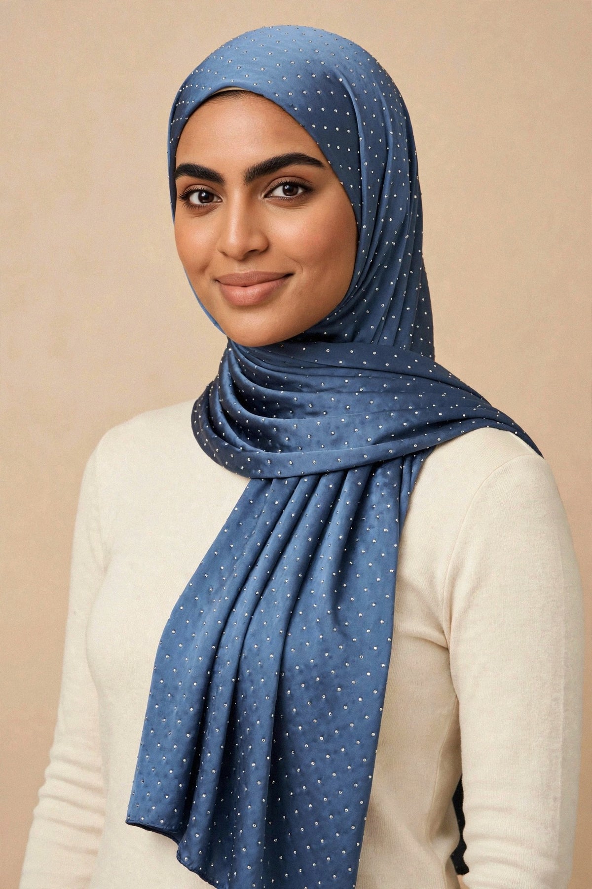 Model wearing the Navy Blue silken diamonds hijab styled with a cream top - Concealed Muslimah