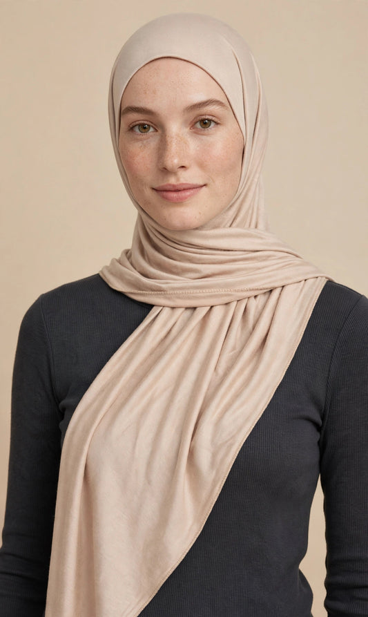 Model wearing the Oatmeal premium jersey hijab styled with a charcoal top - Concealed Muslimah