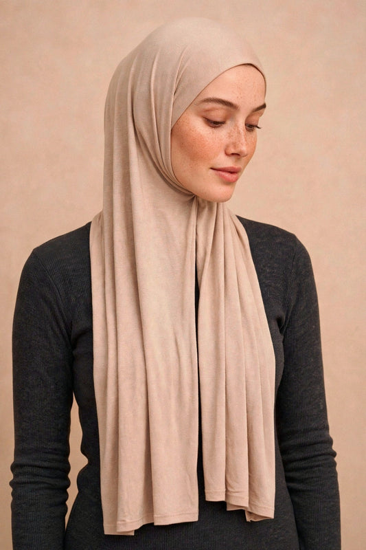 Model wearing the Oatmeal premium jersey hijab styled with a charcoal top - Concealed Muslimah