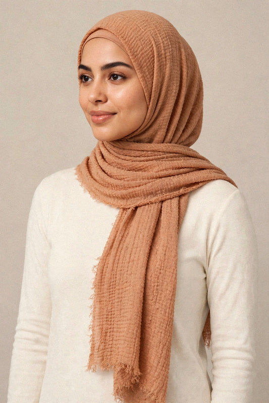 Model wearing the Pastel Peach crimple hijab - Concealed Muslimah