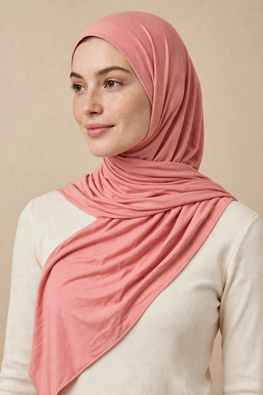 Model wearing the Peachy Pink premium jersey hijab styled with a cream top - Concealed Muslimah