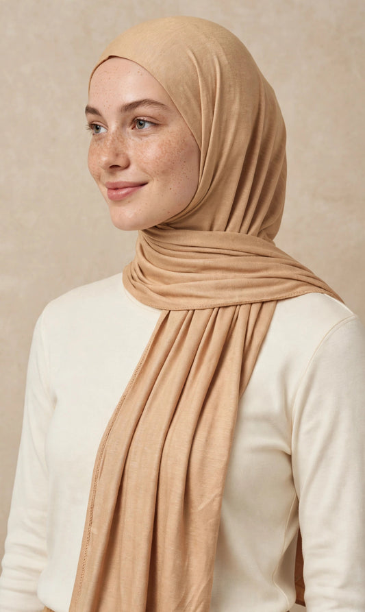 Model wearing the Peanut Butter premium jersey hijab styled with a cream top - Concealed Muslimah