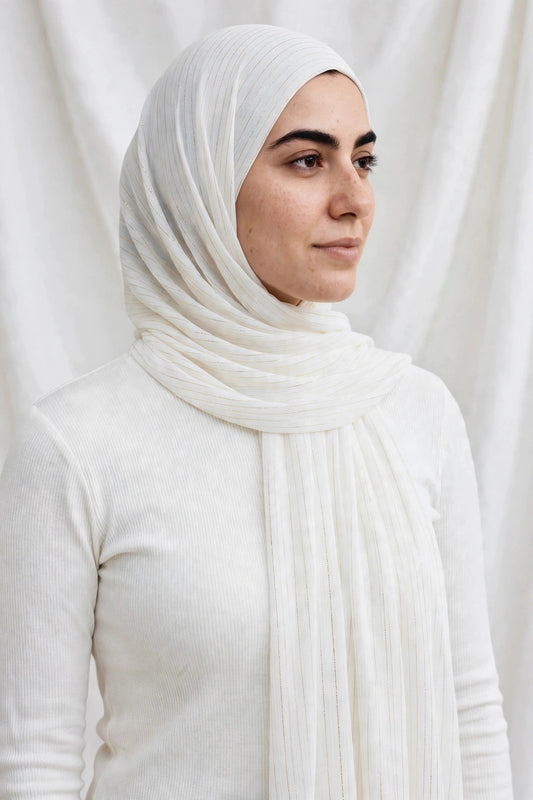 Model wearing the Pearl White timeless edition hijab styled with a white top - Concealed Muslimah