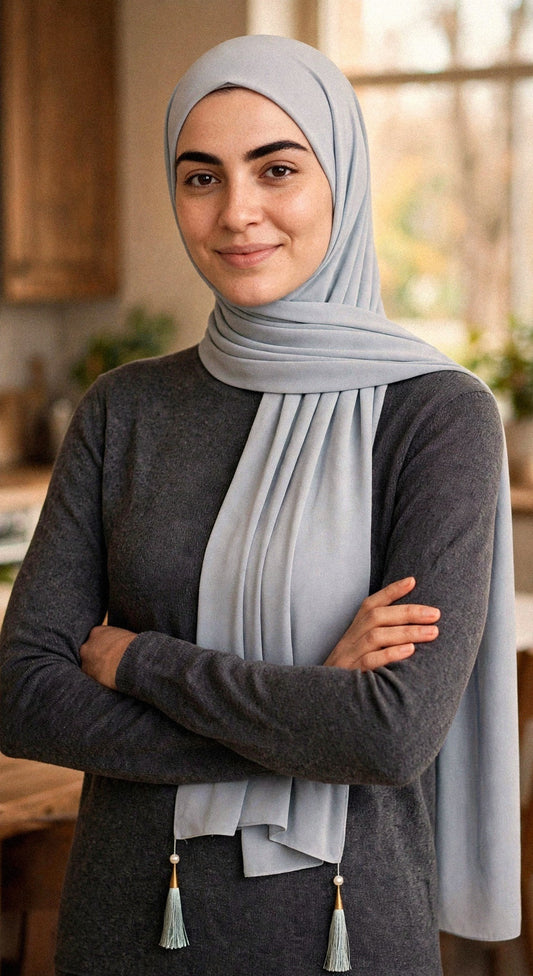 Model wearing the Pebbles cleopatra hijab styled with a charcoal top - Concealed Muslimah