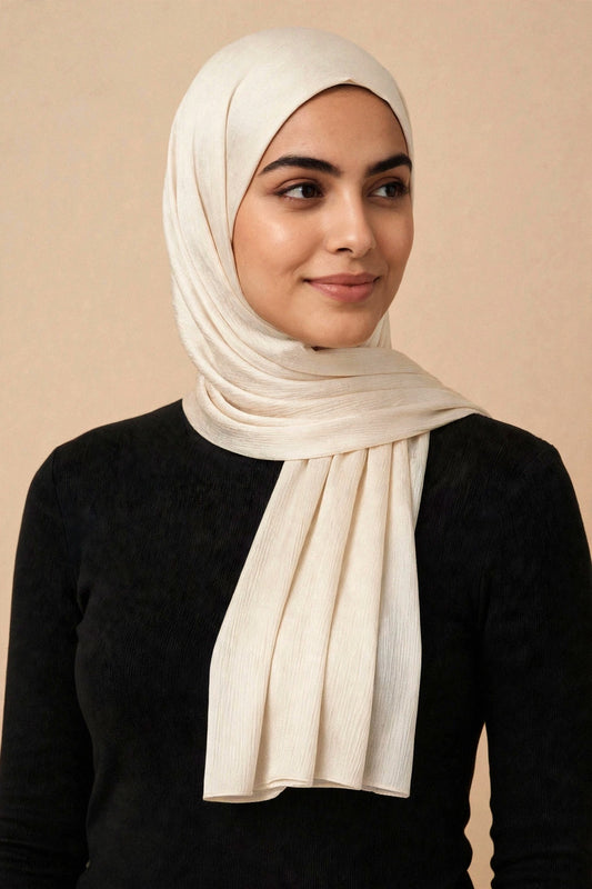 Model wearing the Pure White chrome hijab styled with a charcoal top - Concealed Muslimah