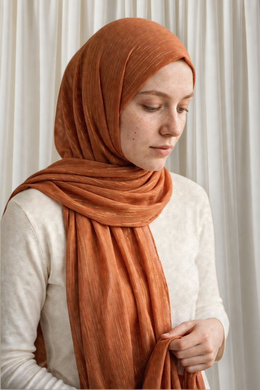 Model wearing the Roasted timeless edition hijab styled with a white top - Concealed Muslimah