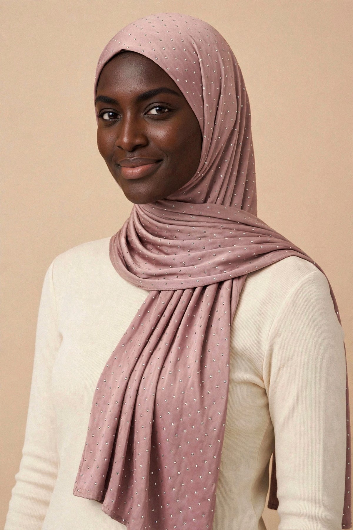 Model wearing the Rose Pink silken diamonds hijab styled with a cream top - Concealed Muslimah